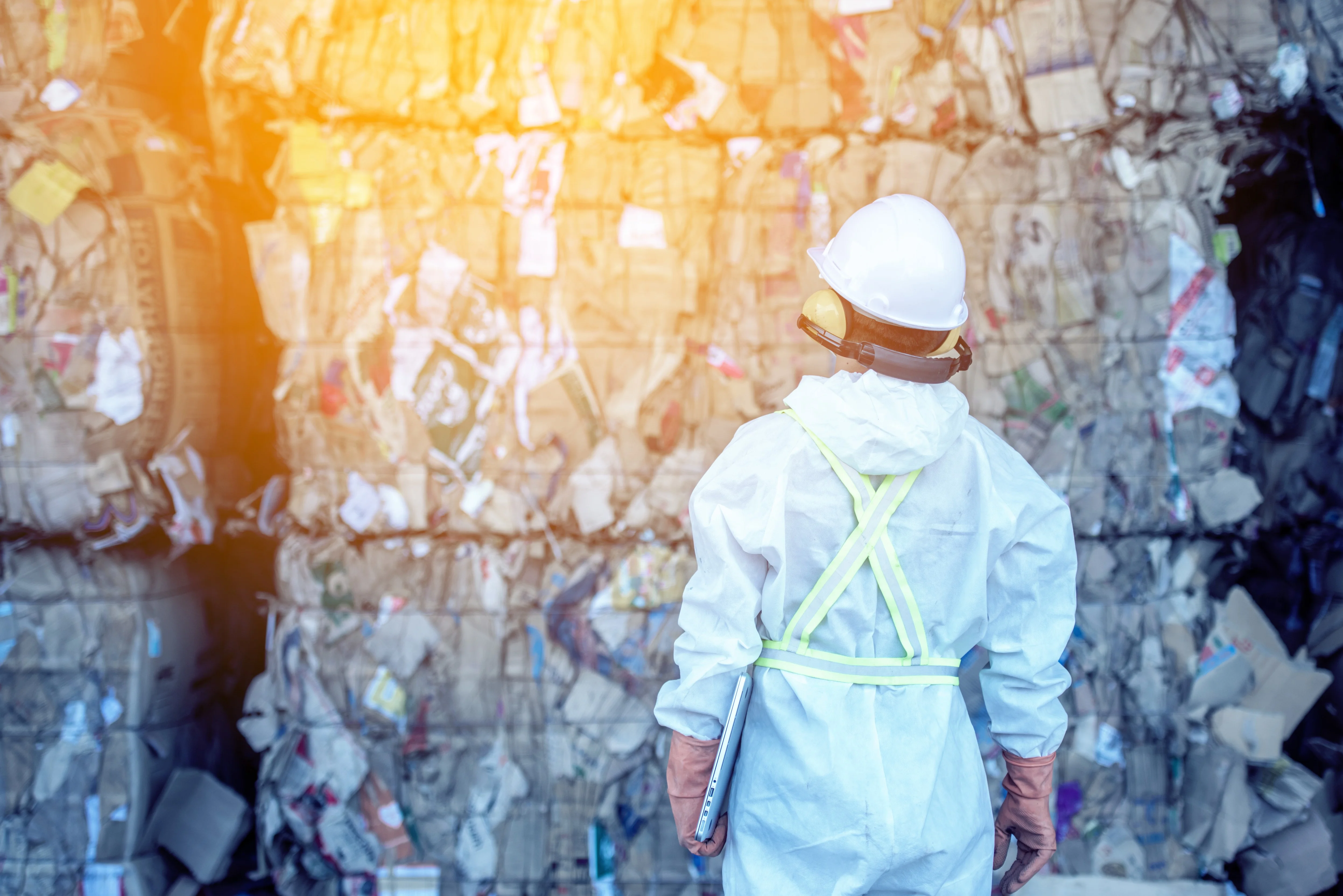 waste-processing-plant-technological-process-plastic-bottles-factory-processing-recycling-worker-recycling-factory-engineers-is-out-focus-blurred